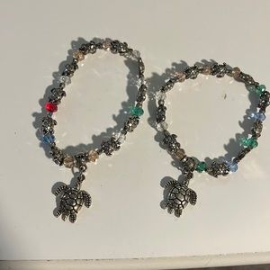 Two bracelets with turtle charms and beads!